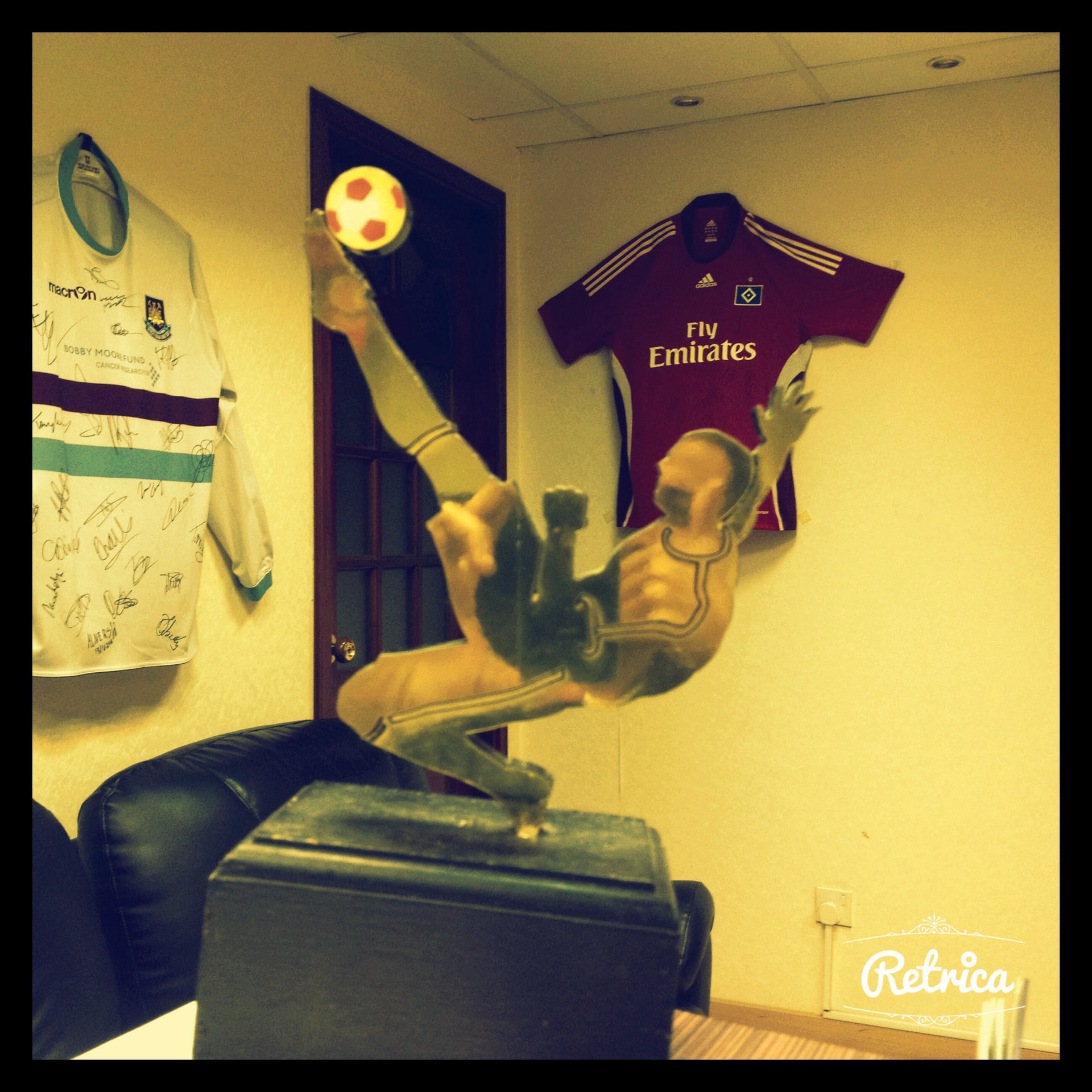 Signed club shirts displayed in the Dubai office
